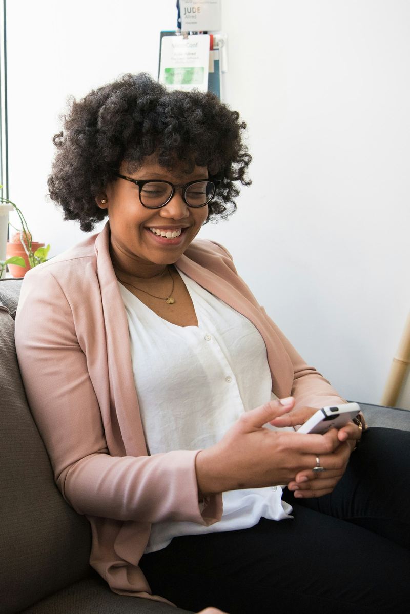 Client following her collab on her phone