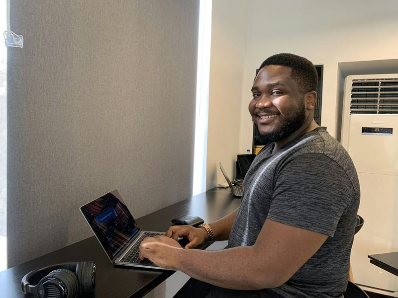 Smiling freelancer at his computer